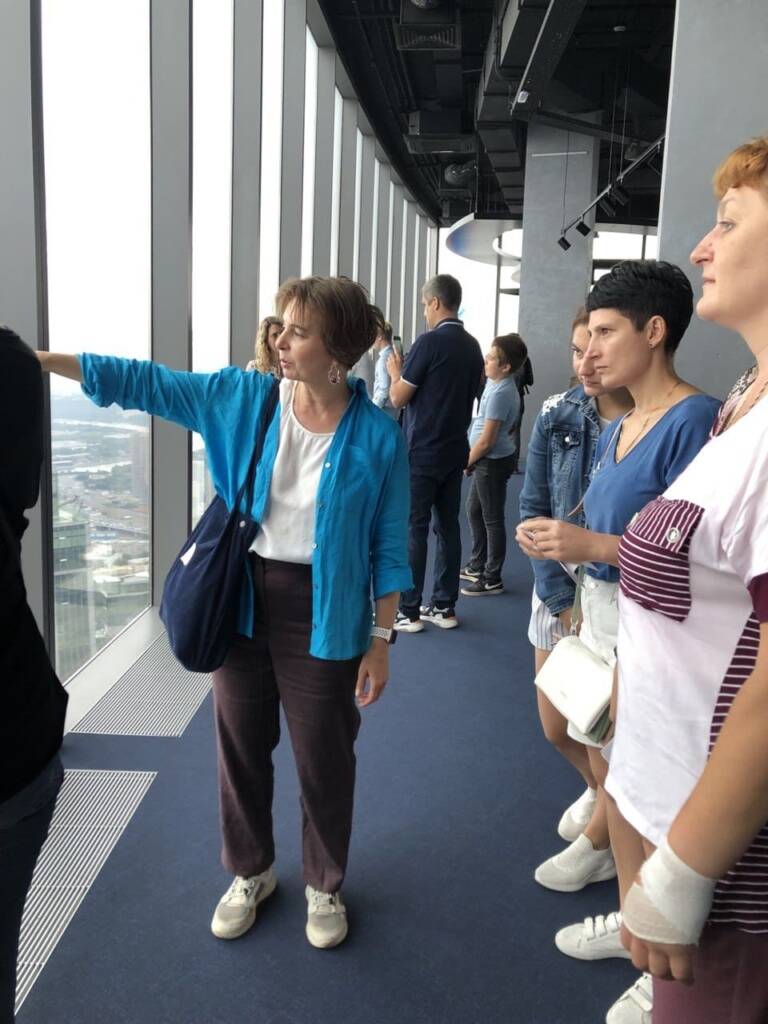 Guide Elena leads a tour inside Moscow City for Russian Railways employees Guide Elena shows the city from the Moscow City tower