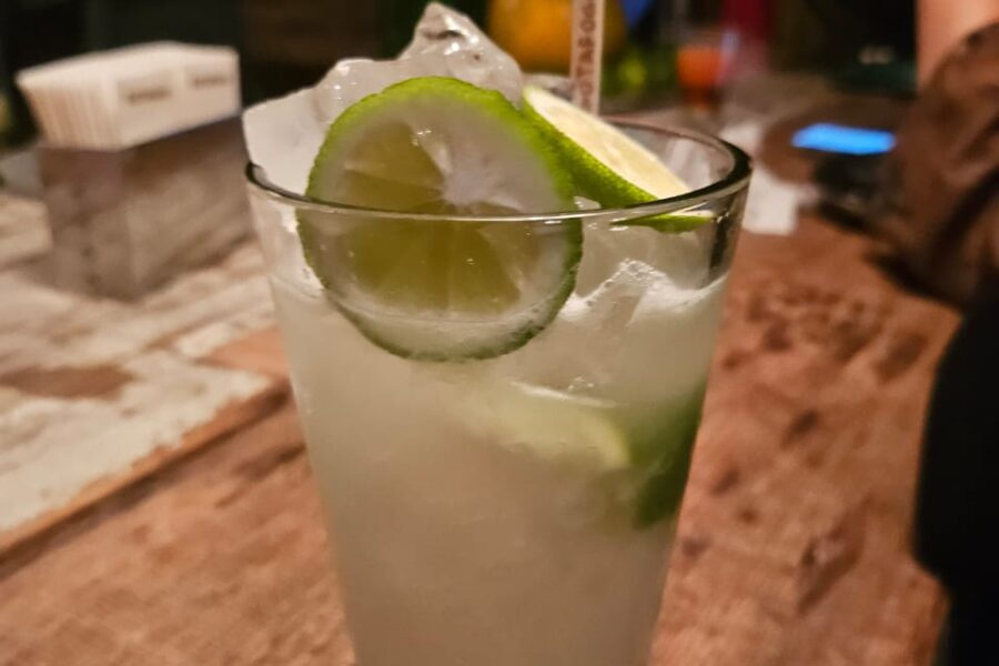 Spanish guests sample drinks at the bar during a drinking tour