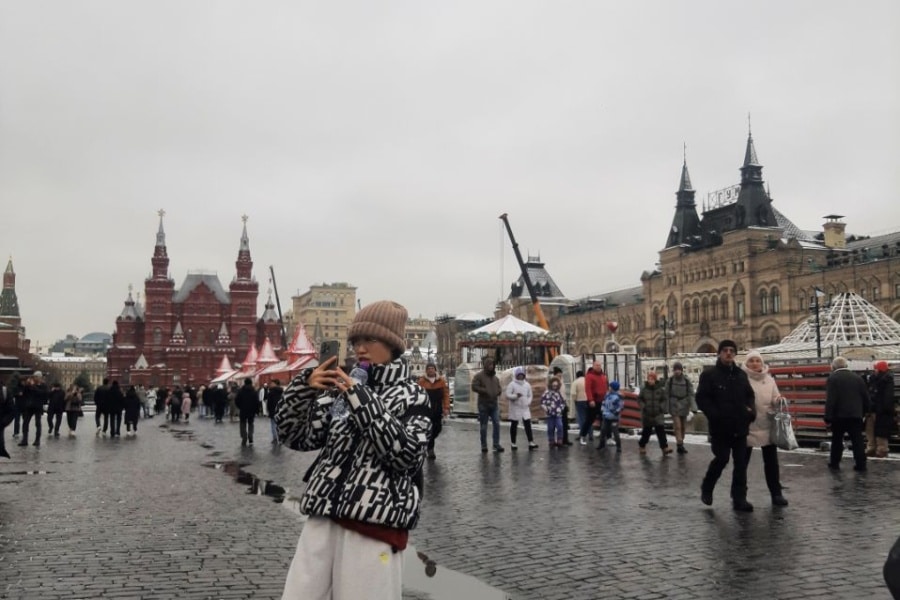 Chinese take photos on Red Square during a tour