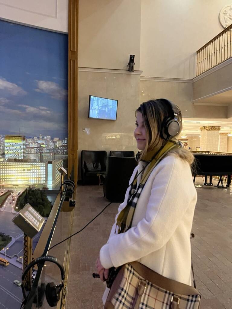 Foreigner admires Moscow diorama at Radisson Hotel. Individual city tour