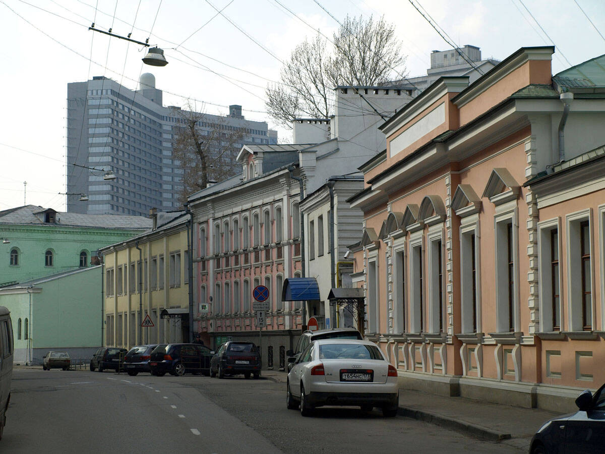 Borisoglebsky Lane, with low-rise buildings on either side and a high-rise in the distance