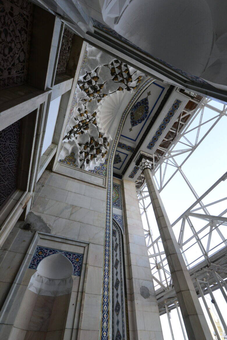 An ornamented opening in Pavilion No. 14 at VDNKh, with a metal framework beside it.