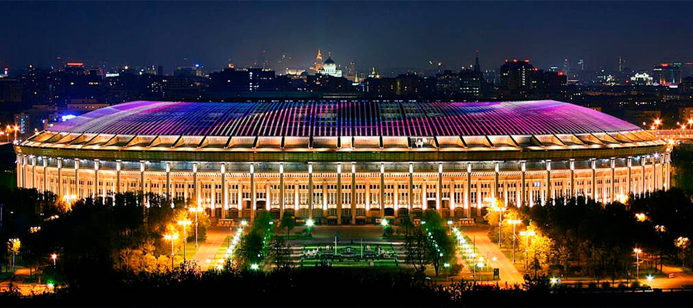 The illuminated façade and colourful roof of Luzhniki Stadium on the evening of 22 October 2017
