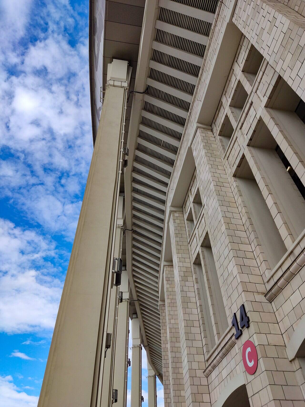 Entrance No. 14 of Luzhniki Stadium, showing the clad façade, columns and roof