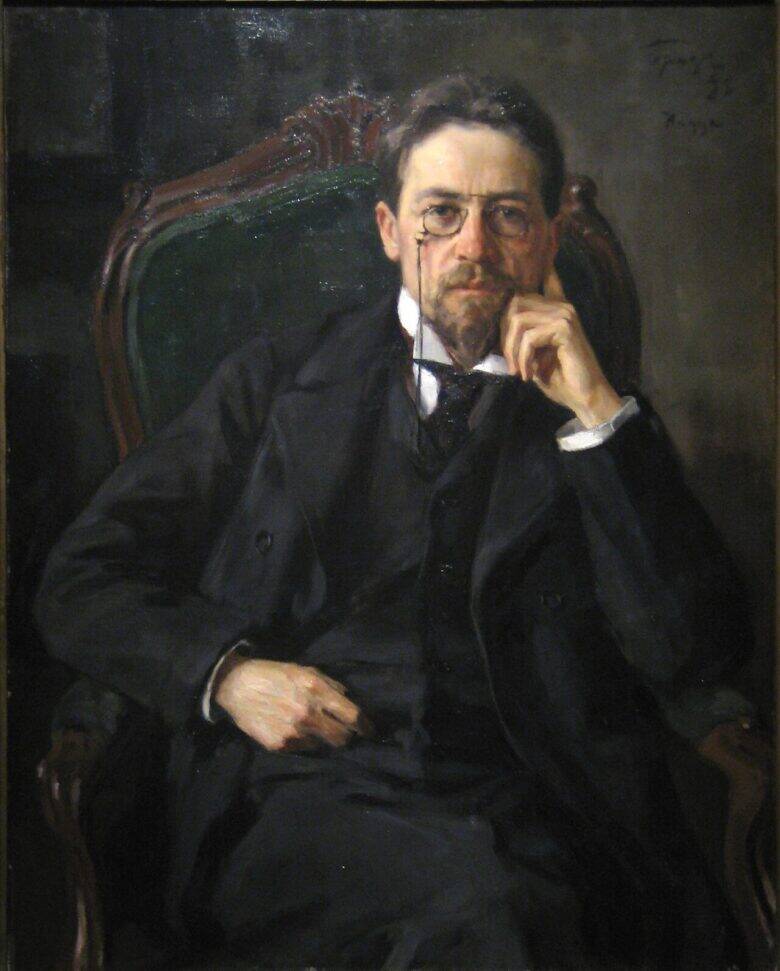 A detail from a painted portrait of Anton Chekhov: the writer, wearing pince-nez, sits in a green-upholstered armchair, resting his face on his hand.