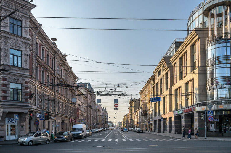 View along Gorokhovaya Street in St Petersburg: building façades, cars and a pedestrian crossing