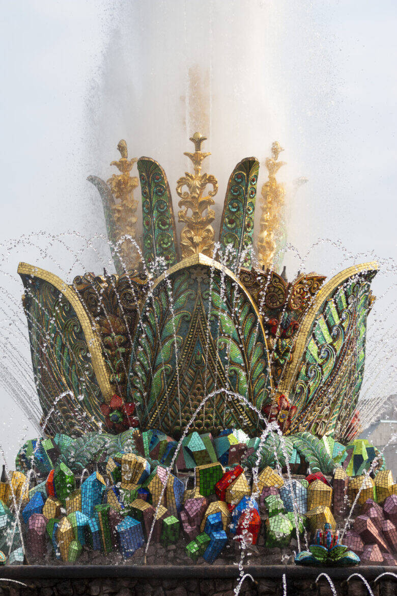 A close-up of the patterned petals of the Stone Flower fountain and the colourful faceted elements at their base.