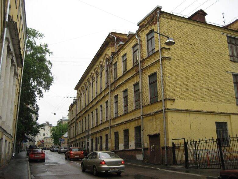 Yellow brick building of the Historical Library along Starosadsky Lane in Moscow